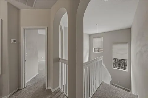 a view of entryway with bathroom and front door