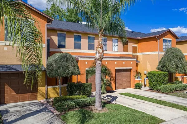 an aerial view of a house with outdoor space