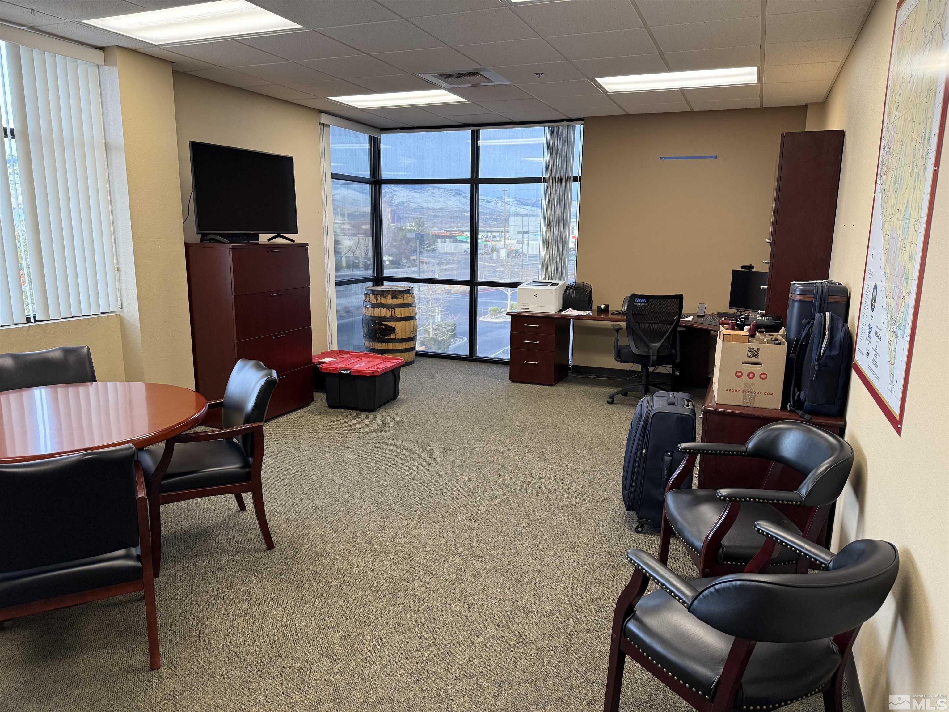1170 South Rock Boulevard, Unit C Reno, NV 89502 - Photo 5 of 7 a living room with furniture and a flat screen tv