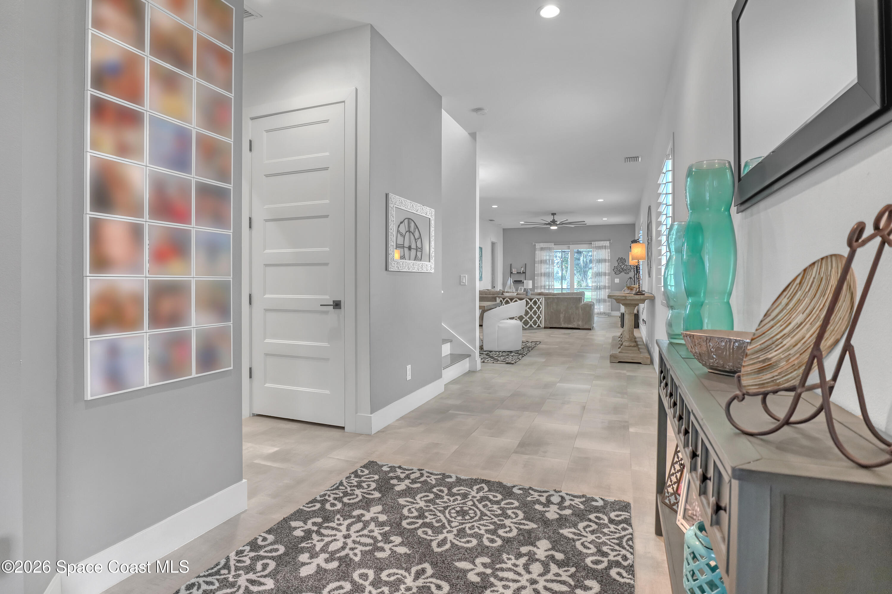 2188 Country Club Road Melbourne, FL 32901 - Photo 11 of 57 a view of a hallway with furniture and a window