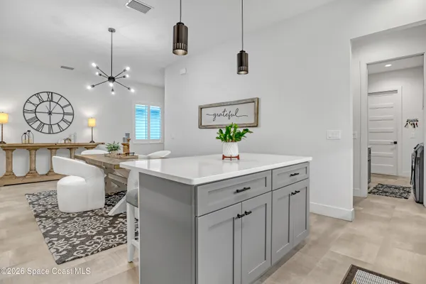 a spacious bathroom with a granite countertop sink a toilet a mirror and shower