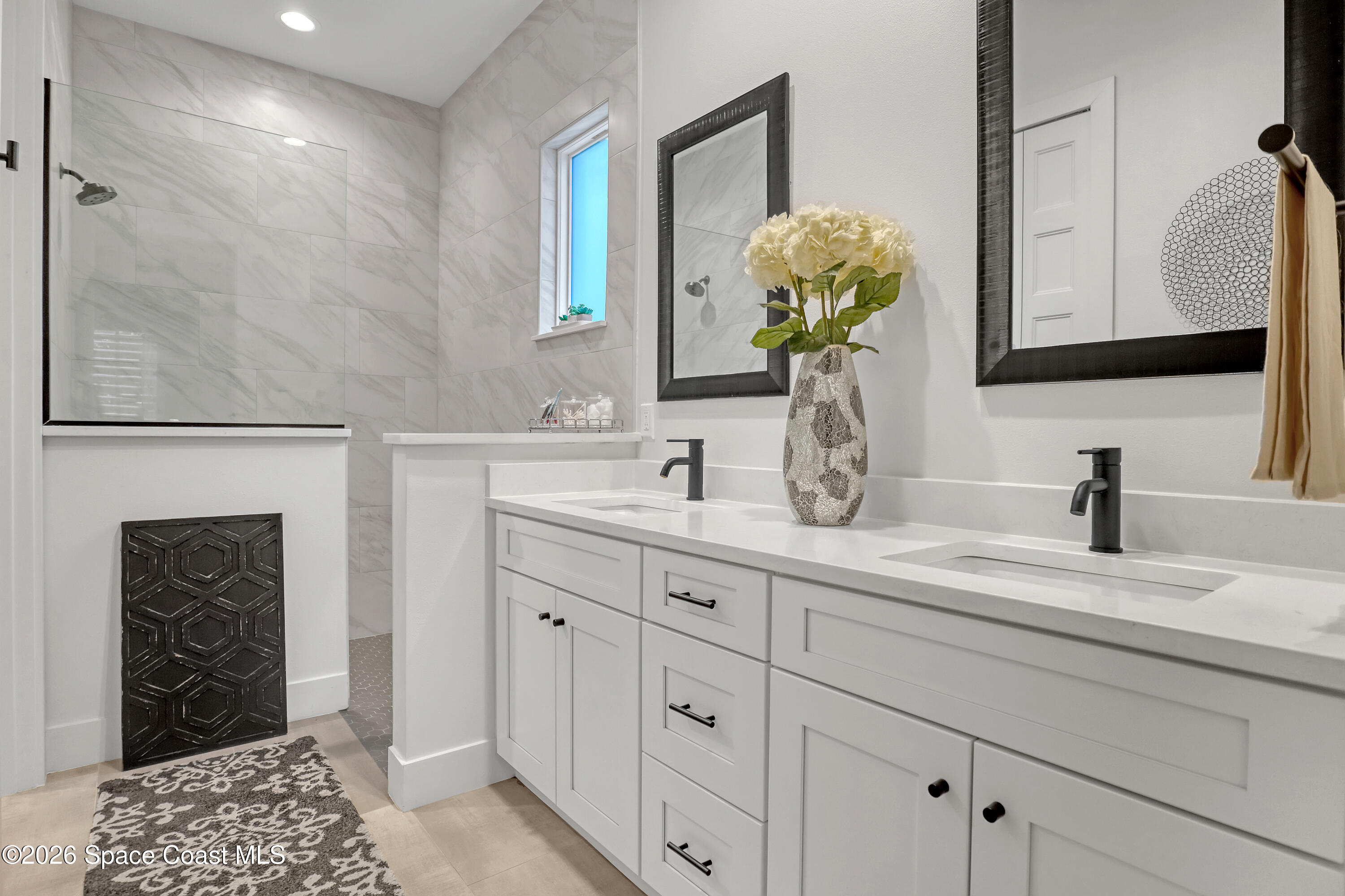 2188 Country Club Road Melbourne, FL 32901 - Photo 26 of 57 a bathroom with a sink and a mirror