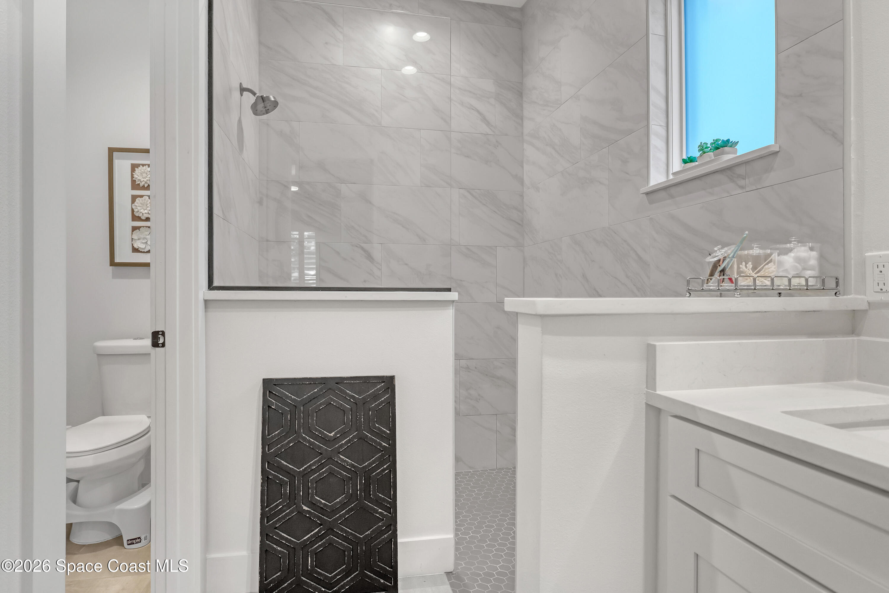 2188 Country Club Road Melbourne, FL 32901 - Photo 27 of 57 a bathroom with a sink and a toilet