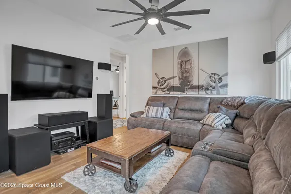 a living room with furniture and a rug
