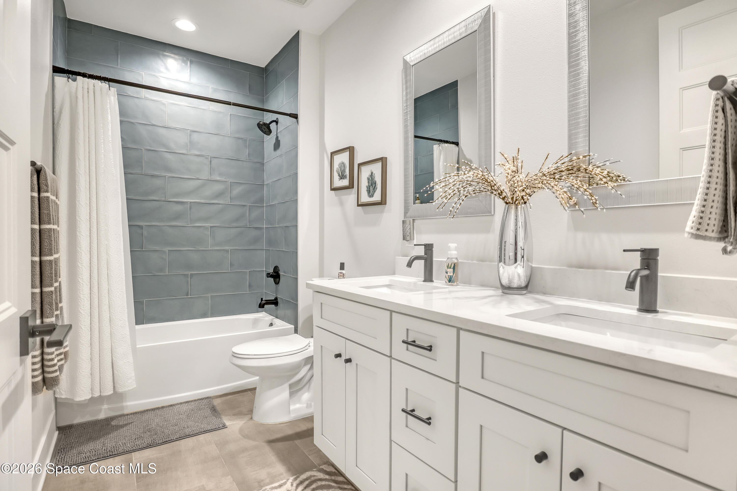 2188 Country Club Road Melbourne, FL 32901 - Photo 36 of 51 a bathroom with a sink a toilet and shower
