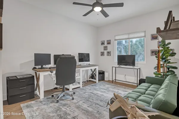 a living room with furniture and a chair