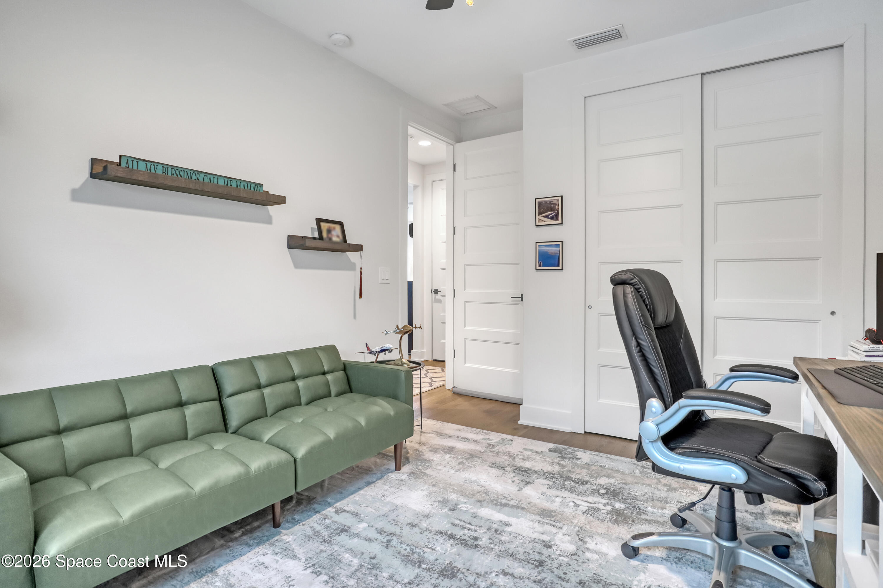 2188 Country Club Road Melbourne, FL 32901 - Photo 38 of 51 a living room with furniture and a chair