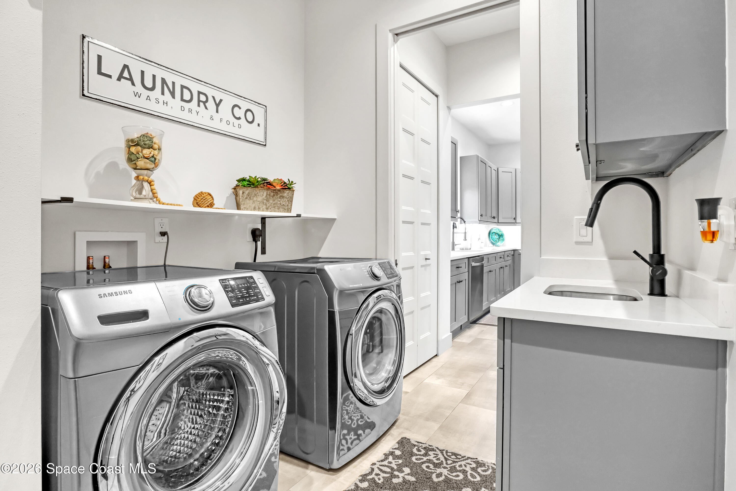 2188 Country Club Road Melbourne, FL 32901 - Photo 39 of 51 a utility room with dryer and washer