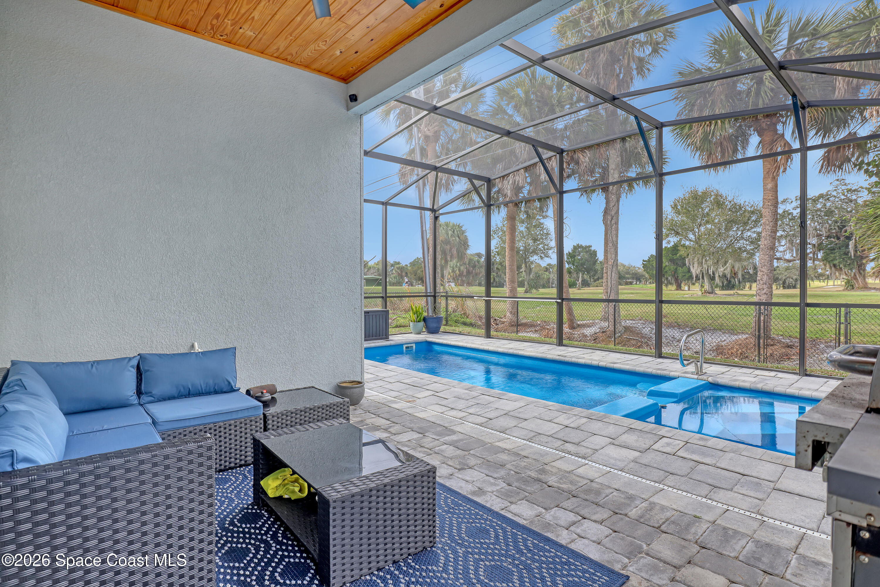 2188 Country Club Road Melbourne, FL 32901 - Photo 40 of 51 a view of living room with furniture and floor to ceiling window