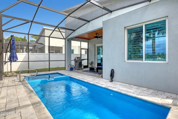 a view of a swimming pool with a porch