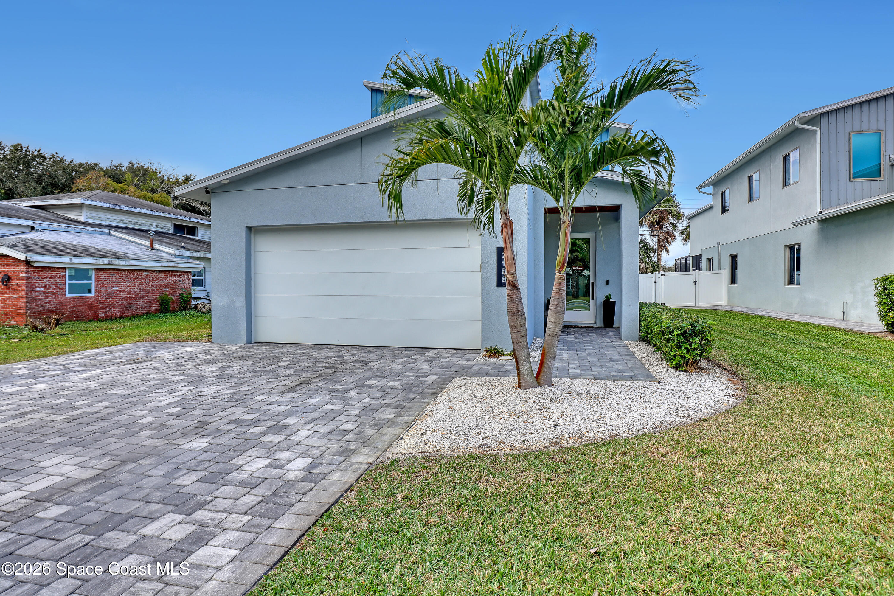 2188 Country Club Road Melbourne, FL 32901 - Photo 5 of 57 a plant in front of a house