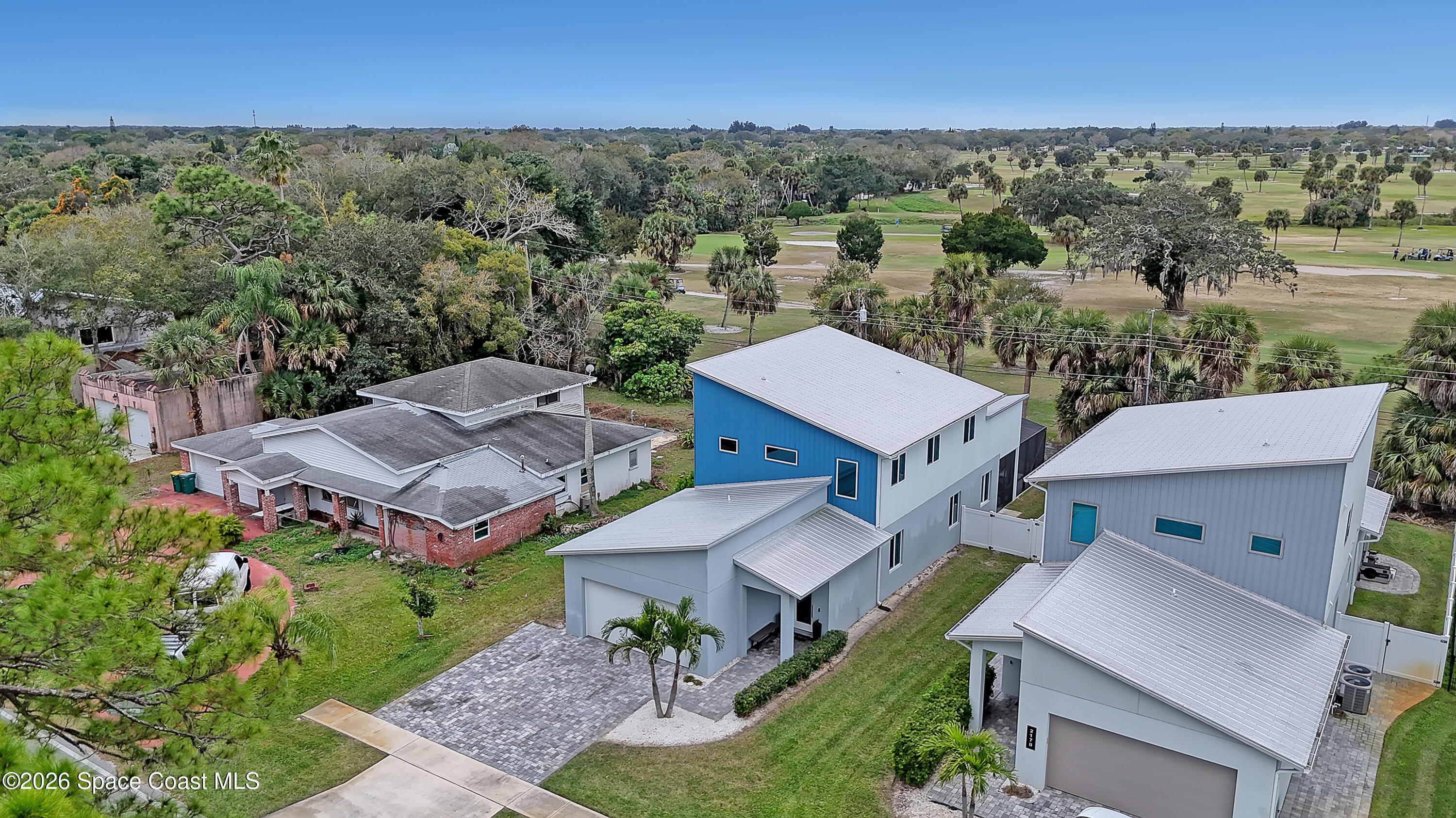 2188 Country Club Road Melbourne, FL 32901 - Photo 53 of 57 an aerial view of a house with a garden