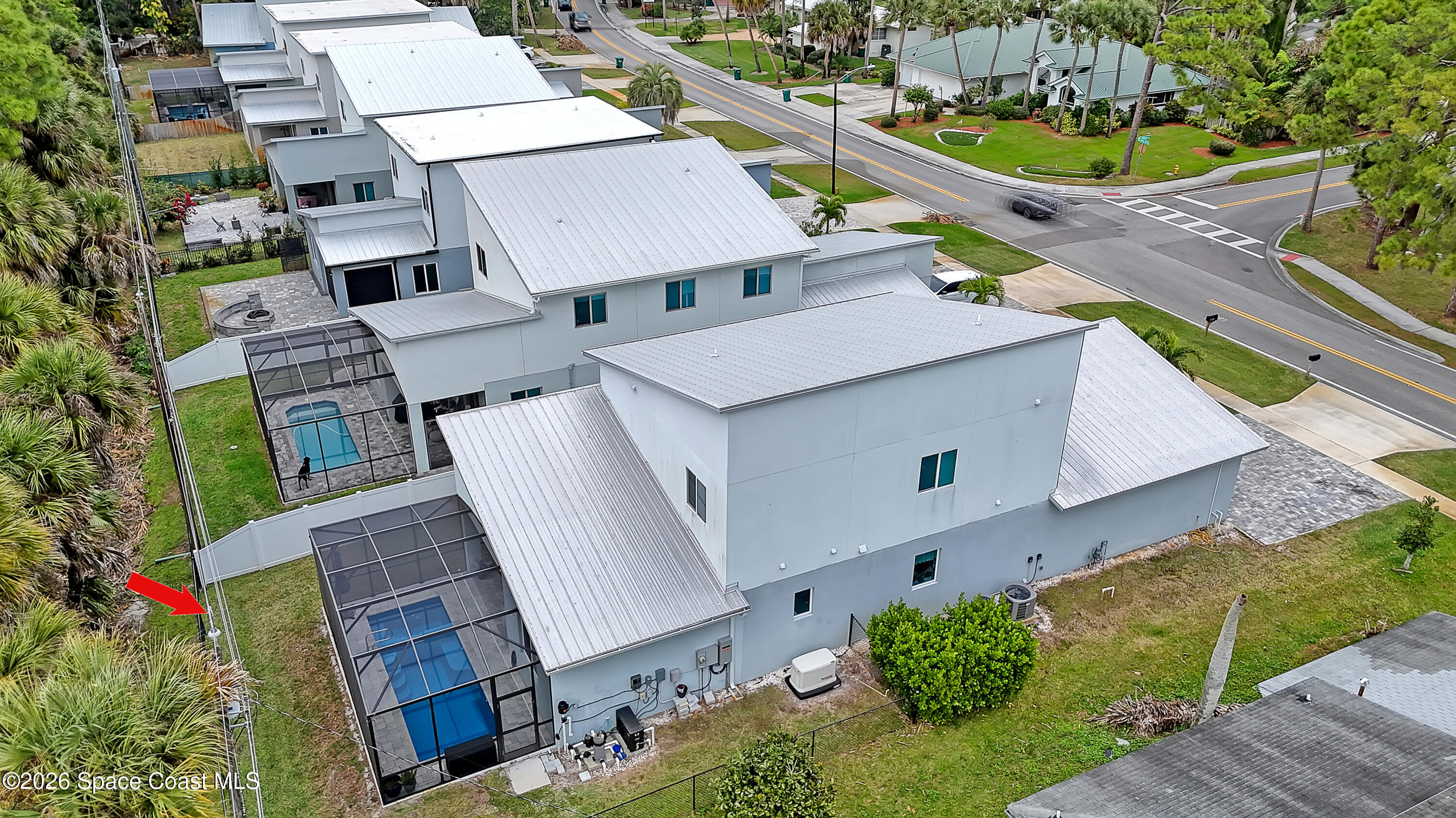 2188 Country Club Road Melbourne, FL 32901 - Photo 54 of 57 an aerial view of a house with a garden