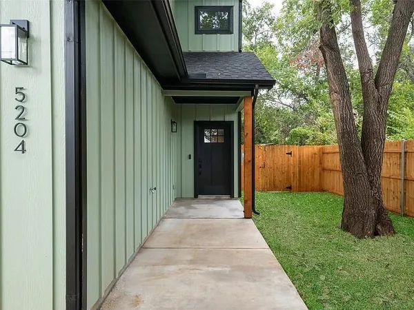 a house view with a garden space