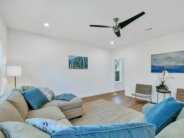 a living room with furniture and a window