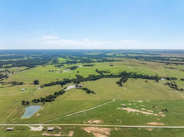 a view of a room with wooden furniture