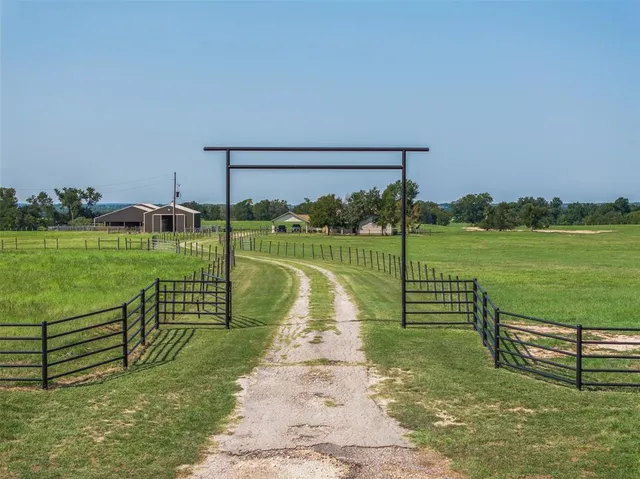 a bathroom with a toilet and a shower curtain