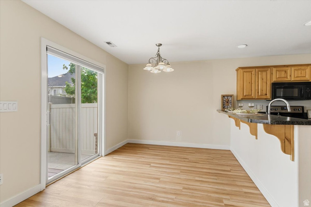 2082 Evans Cove Loop Layton, UT 84041 - Photo 8 of 25 Dining area with sliding glass door to patio