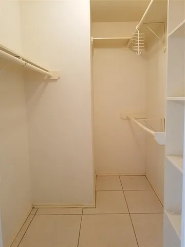 a view of an empty walk in closet