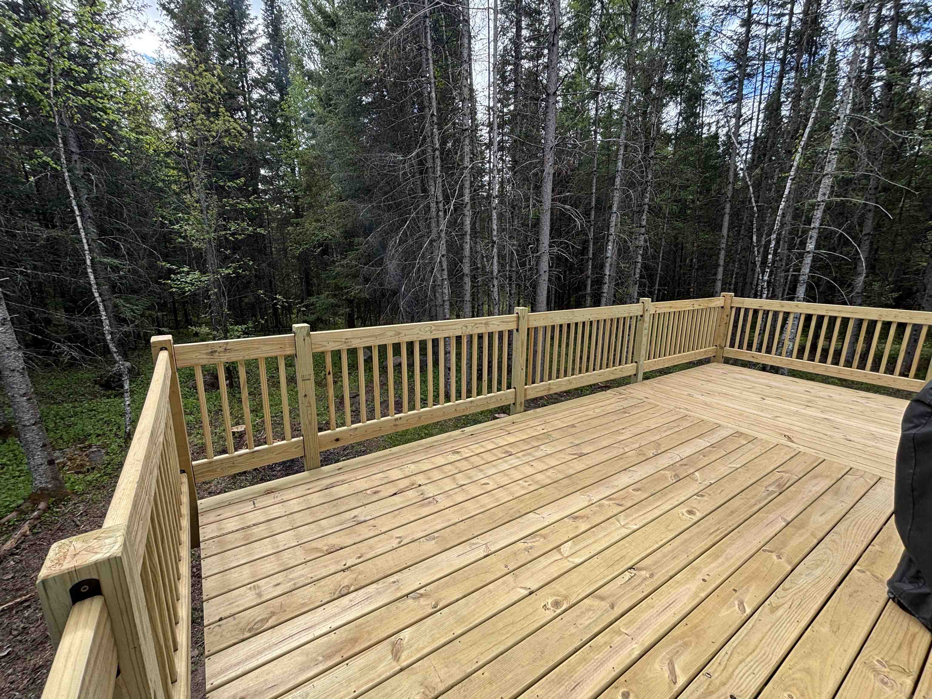 7238 Morris Thomas Road Cloquet, MN 55720 - Photo 21 of 27 Wooden terrace featuring a forest view