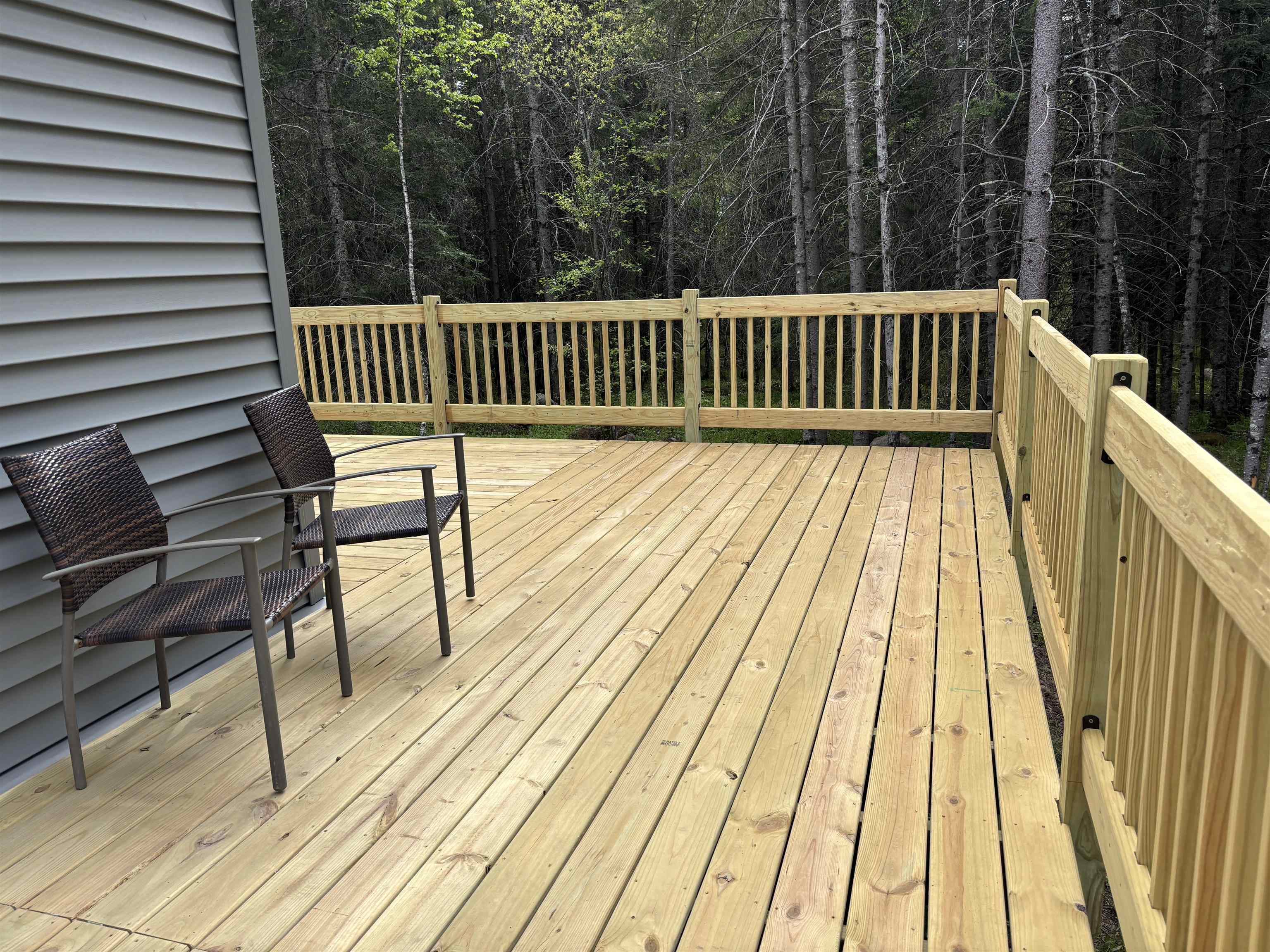 7238 Morris Thomas Road Cloquet, MN 55720 - Photo 22 of 27 Wooden deck with a wooded view