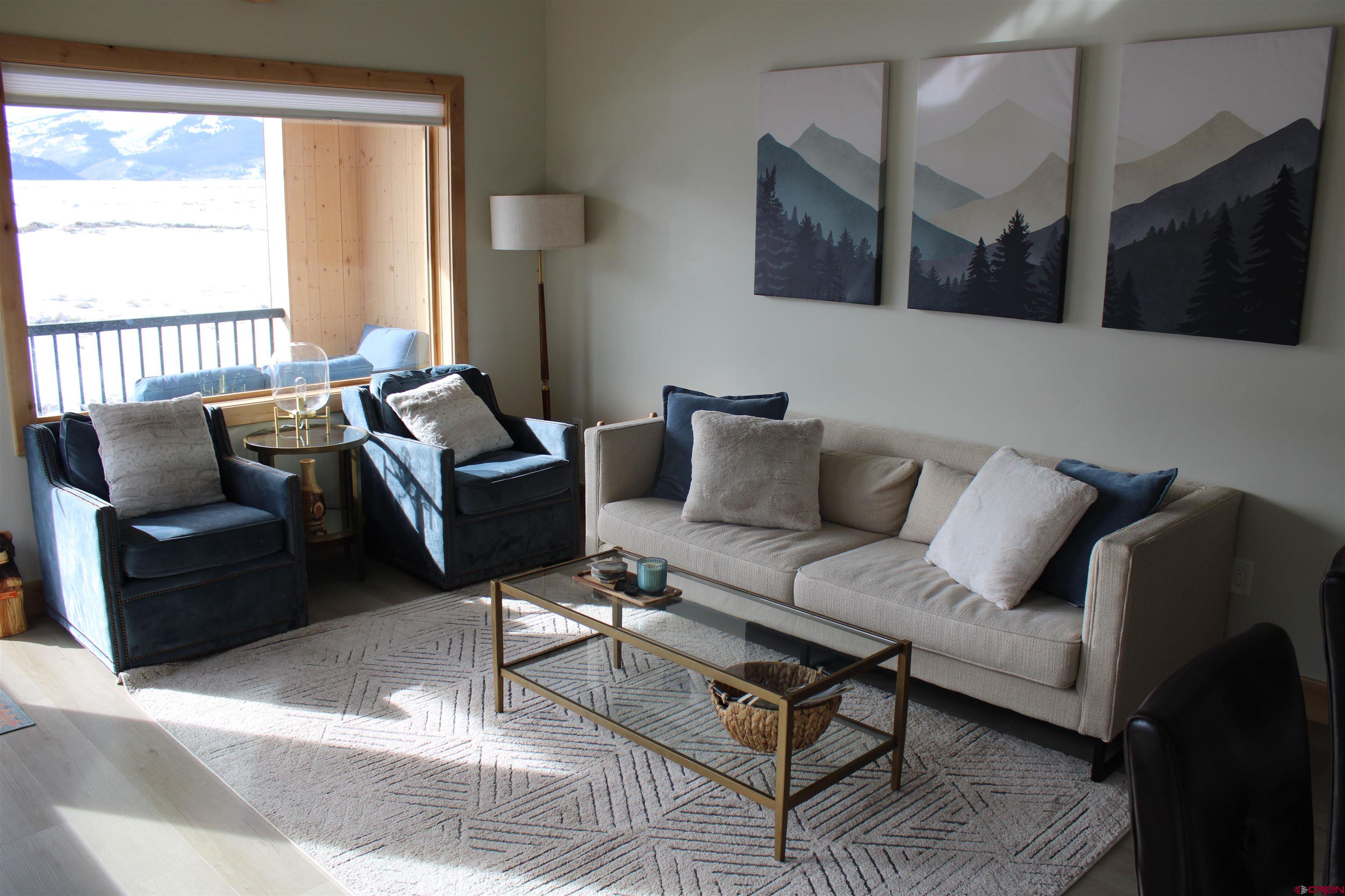 101 Elk Valley Road, Unit C Crested Butte, CO 81224 - Photo 2 of 41 a living room with furniture and a window