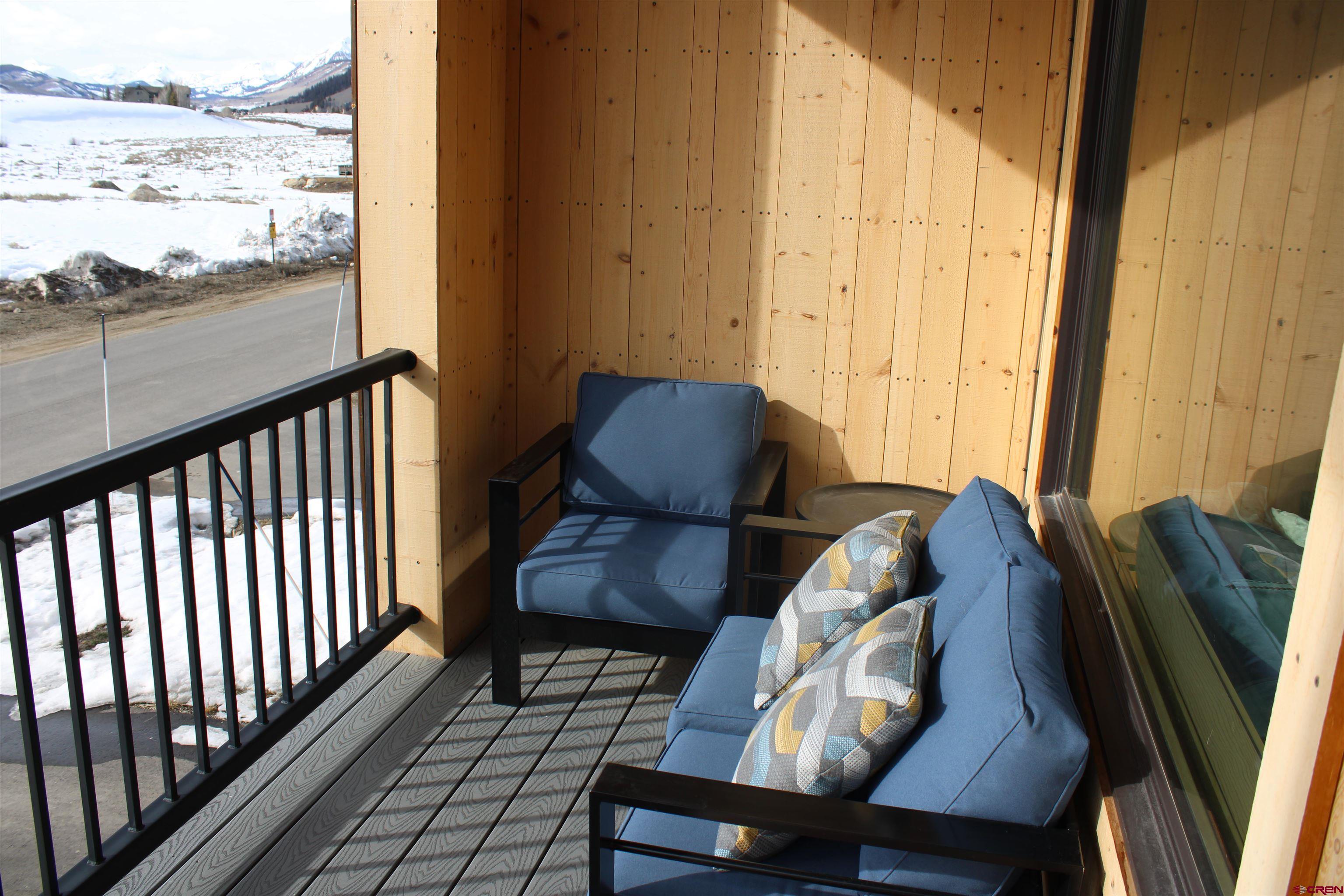 101 Elk Valley Road, Unit C Crested Butte, CO 81224 - Photo 33 of 41 a living room with furniture and a large window