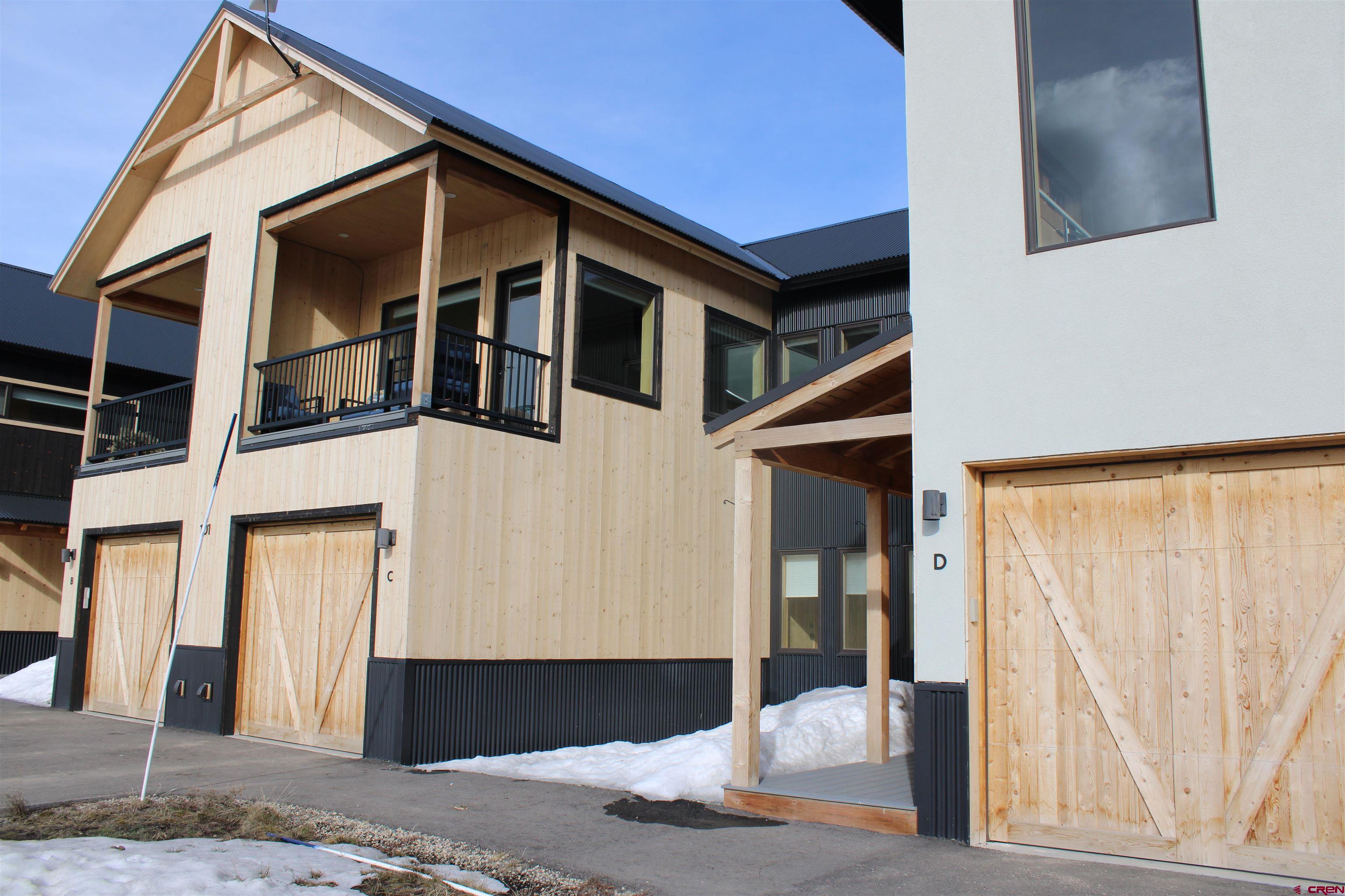 101 Elk Valley Road, Unit C Crested Butte, CO 81224 - Photo 36 of 41 a front view of a house with a garden