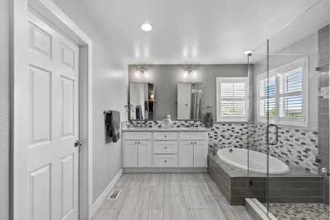 a bathroom with a bathtub sink and toilet