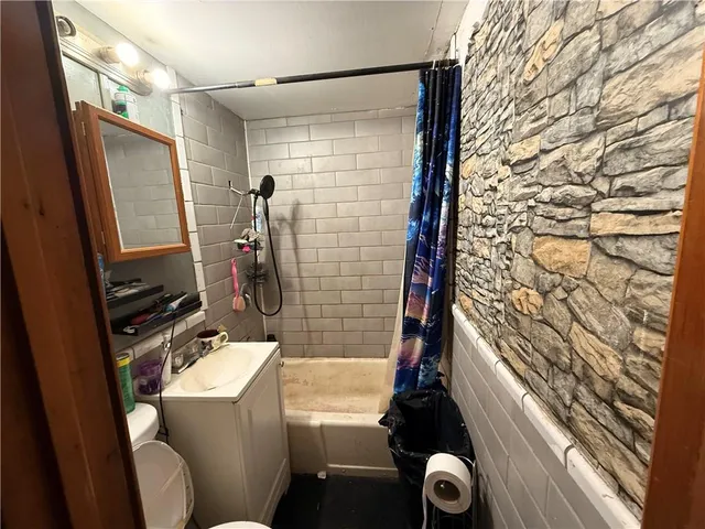 a bed room with a bed and a lamp