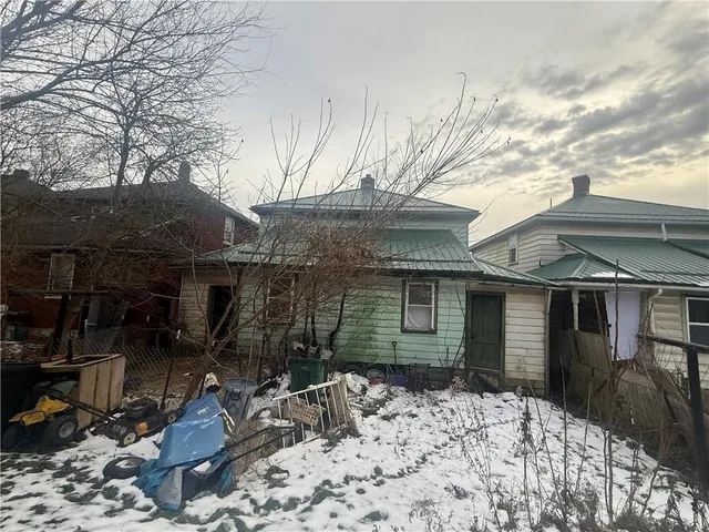 a bed room with a bed and a chair