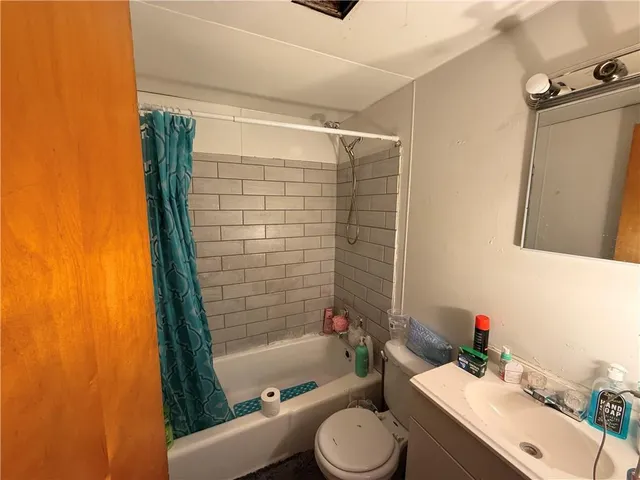 a room with furniture and a wooden floor