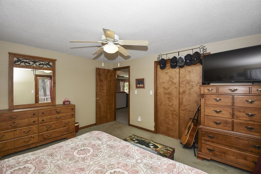 11 Hospital Road Templeton, MA 01436 - Photo 13 of 28 a bedroom with a bed and a mirror on dresser