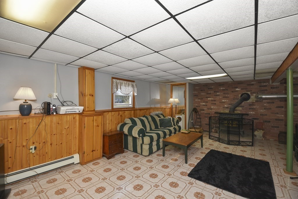 11 Hospital Road Templeton, MA 01436 - Photo 14 of 28 a living room with furniture a flat screen tv and a table