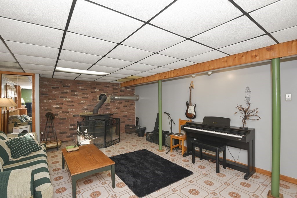 11 Hospital Road Templeton, MA 01436 - Photo 15 of 28 a living room with furniture and a fireplace