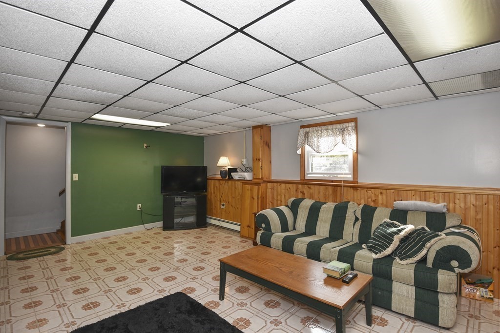 11 Hospital Road Templeton, MA 01436 - Photo 16 of 28 a living room with furniture and a flat screen tv