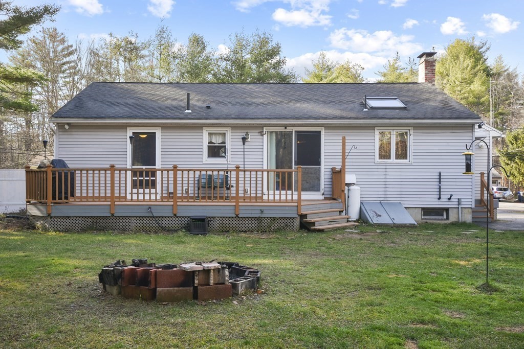 11 Hospital Road Templeton, MA 01436 - Photo 23 of 28 a backyard of a house with table and chairs