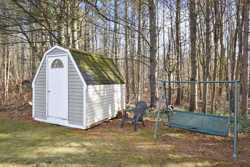 11 Hospital Road Templeton, MA 01436 - Photo 26 of 28 a backyard of a house with table and chairs