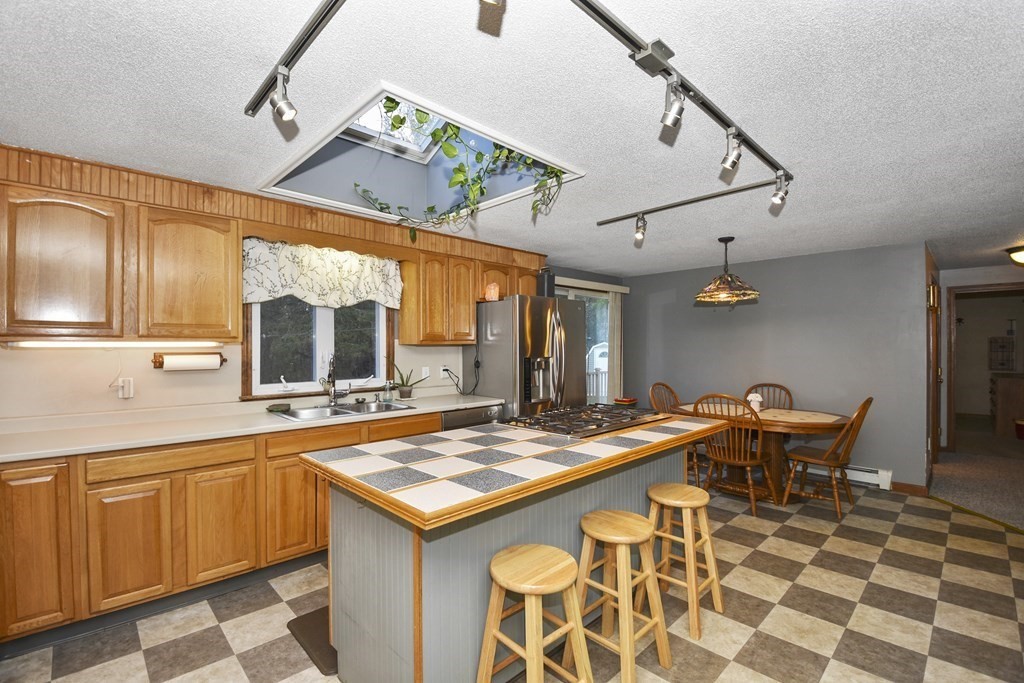 11 Hospital Road Templeton, MA 01436 - Photo 4 of 28 a kitchen with a table and chairs in it
