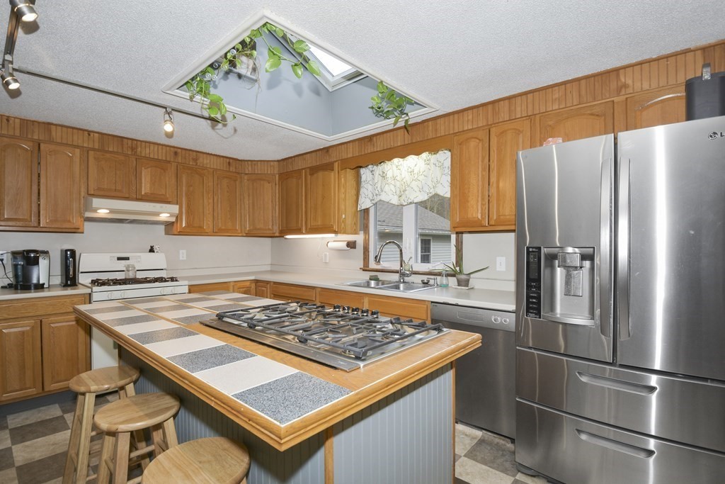 11 Hospital Road Templeton, MA 01436 - Photo 6 of 28 a kitchen with kitchen island a counter space a sink appliances and cabinets