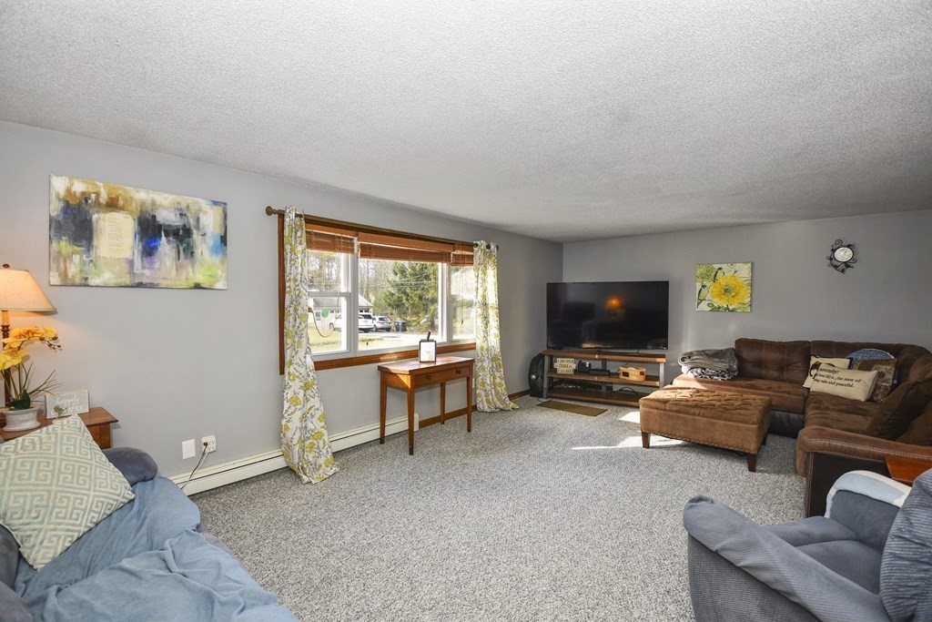11 Hospital Road Templeton, MA 01436 - Photo 7 of 28 a view of a livingroom with furniture and a flat screen tv