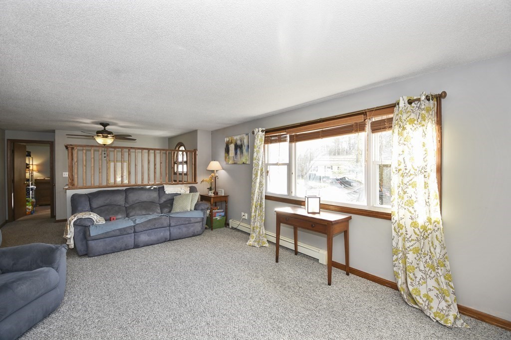 11 Hospital Road Templeton, MA 01436 - Photo 9 of 28 a living room with furniture and a large window