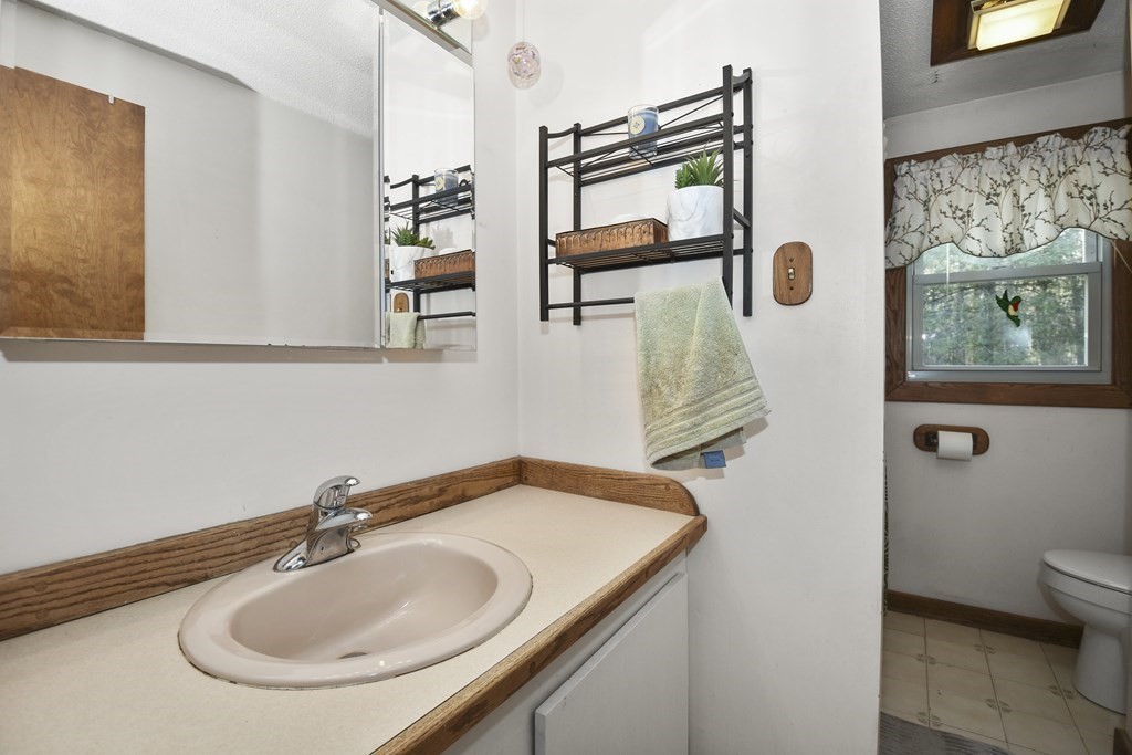 11 Hospital Road Templeton, MA 01436 - Photo 10 of 28 a bathroom with a sink and mirror