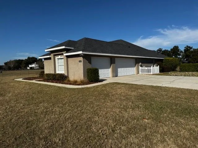 a house with trees in the background