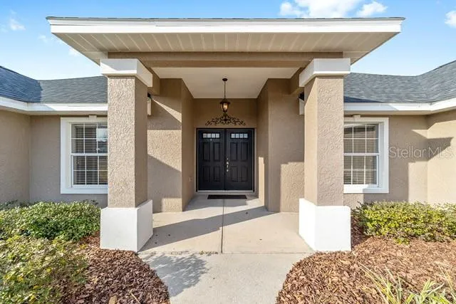 a view of a hallway with front door