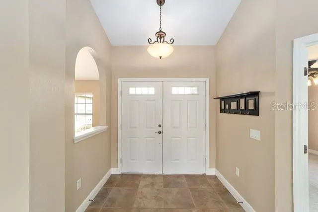 a view of a kitchen with a sink and a window