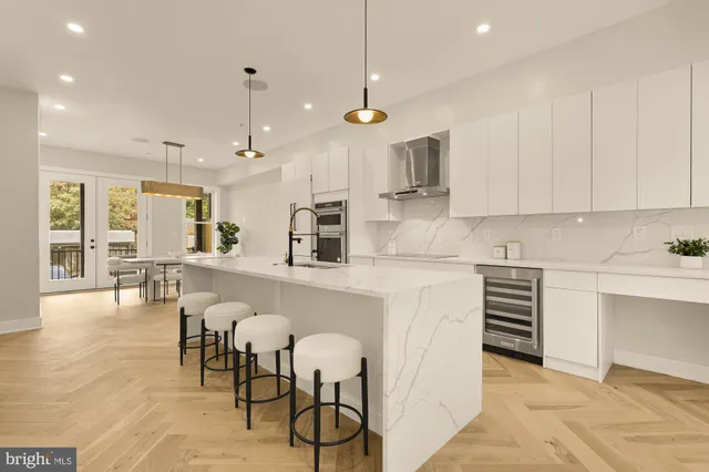 a kitchen with stainless steel appliances a sink and cabinets