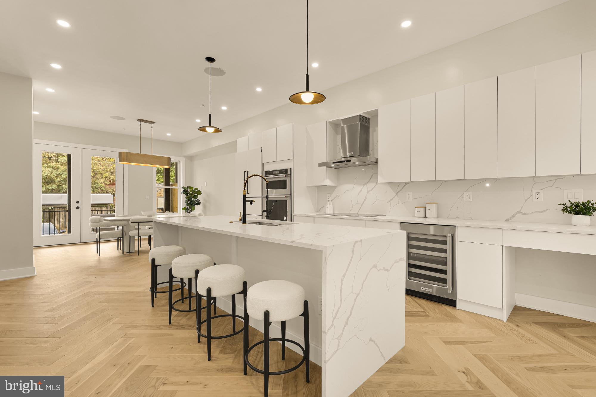 3703 Reservoir Road Northwest Washington, DC 20007 - Photo 12 of 60 a kitchen with cabinets and chairs