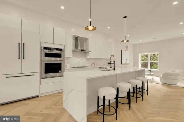 a kitchen with cabinets and appliances