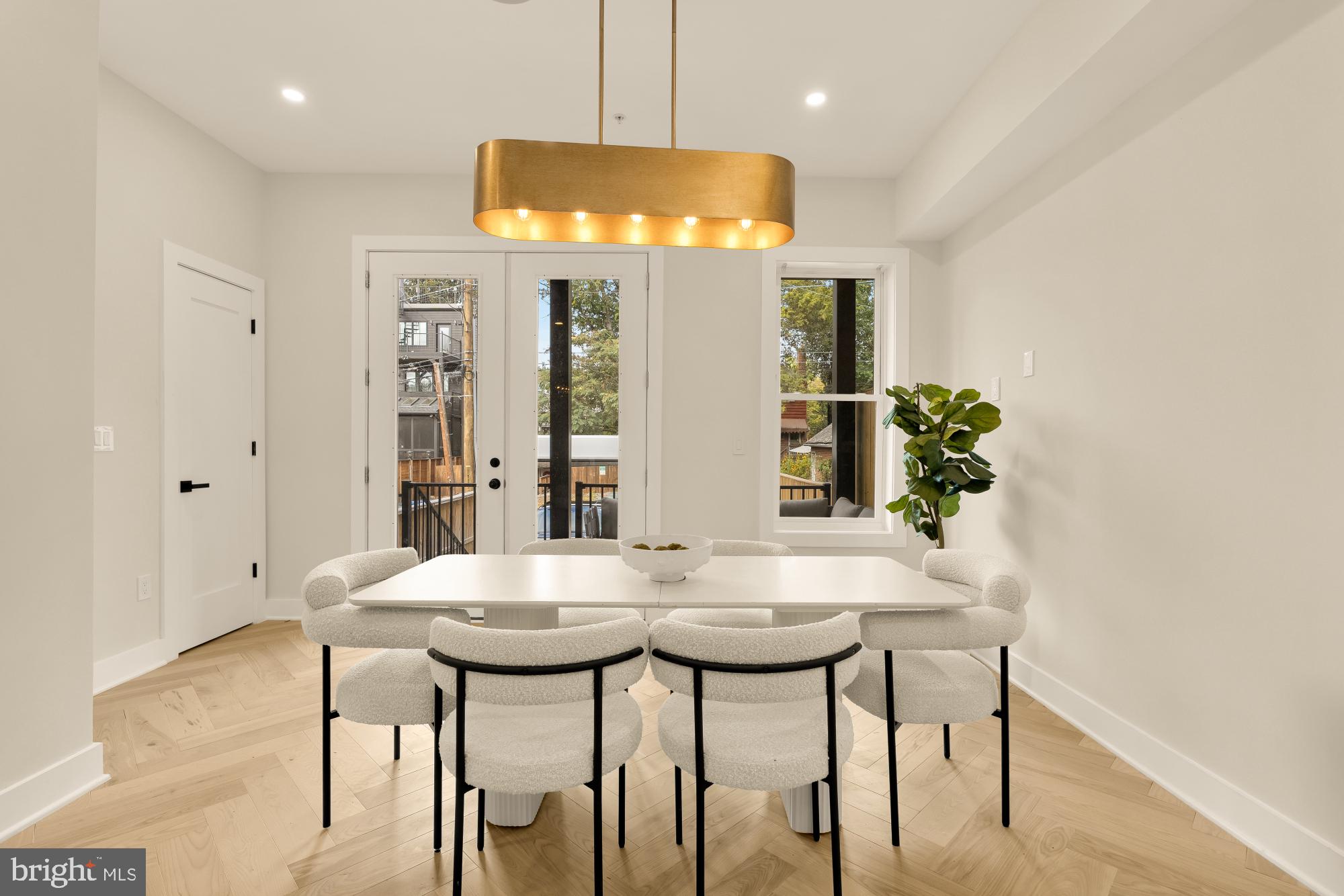 3703 Reservoir Road Northwest Washington, DC 20007 - Photo 20 of 60 a view of a dining room with furniture and wooden floor